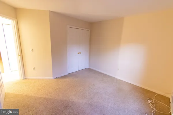 a bathroom with a toilet and a bathtub
