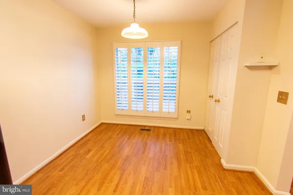 a view of livingroom with hardwood floor and a ceiling fan