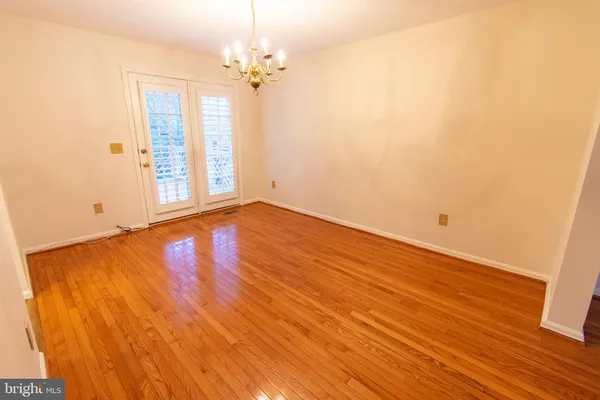 a view of hallway with wooden floor