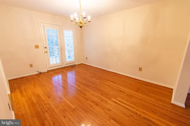 a view of hallway with wooden floor
