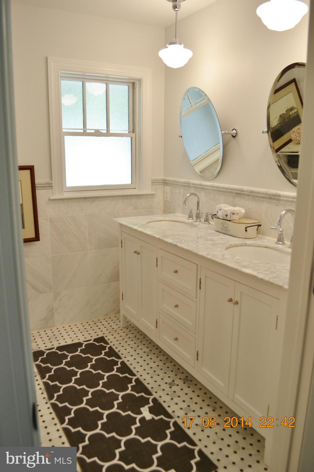 4242 Butler Road Glyndon, MD 21136 - Photo 20 of 29 a bathroom with a sink and a mirror