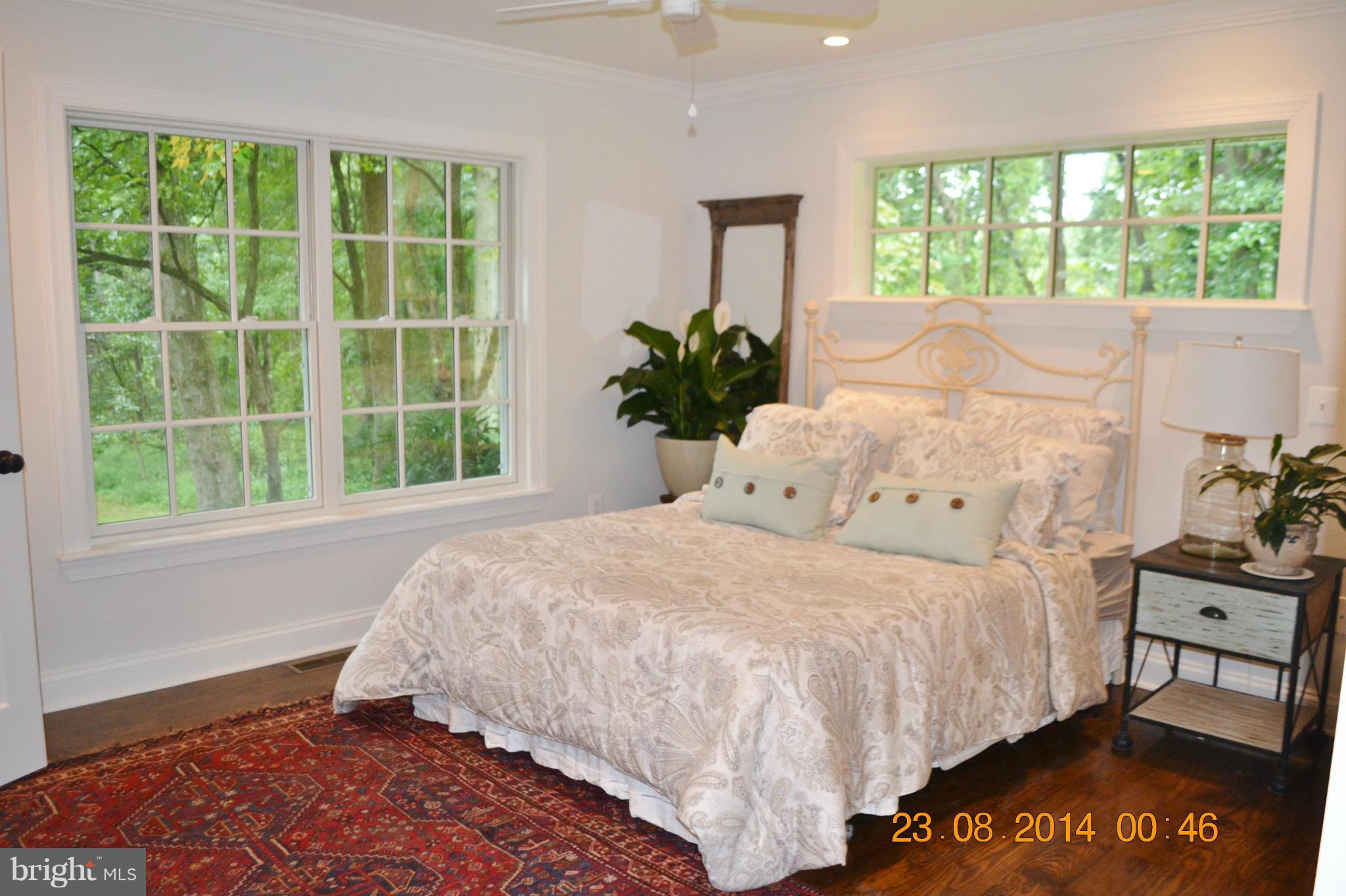 4242 Butler Road Glyndon, MD 21136 - Photo 21 of 29 a bedroom with a bed and a window