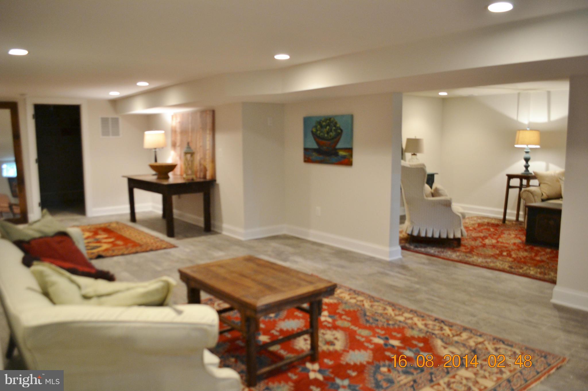 4242 Butler Road Glyndon, MD 21136 - Photo 25 of 29 a living room with furniture and a wooden floor