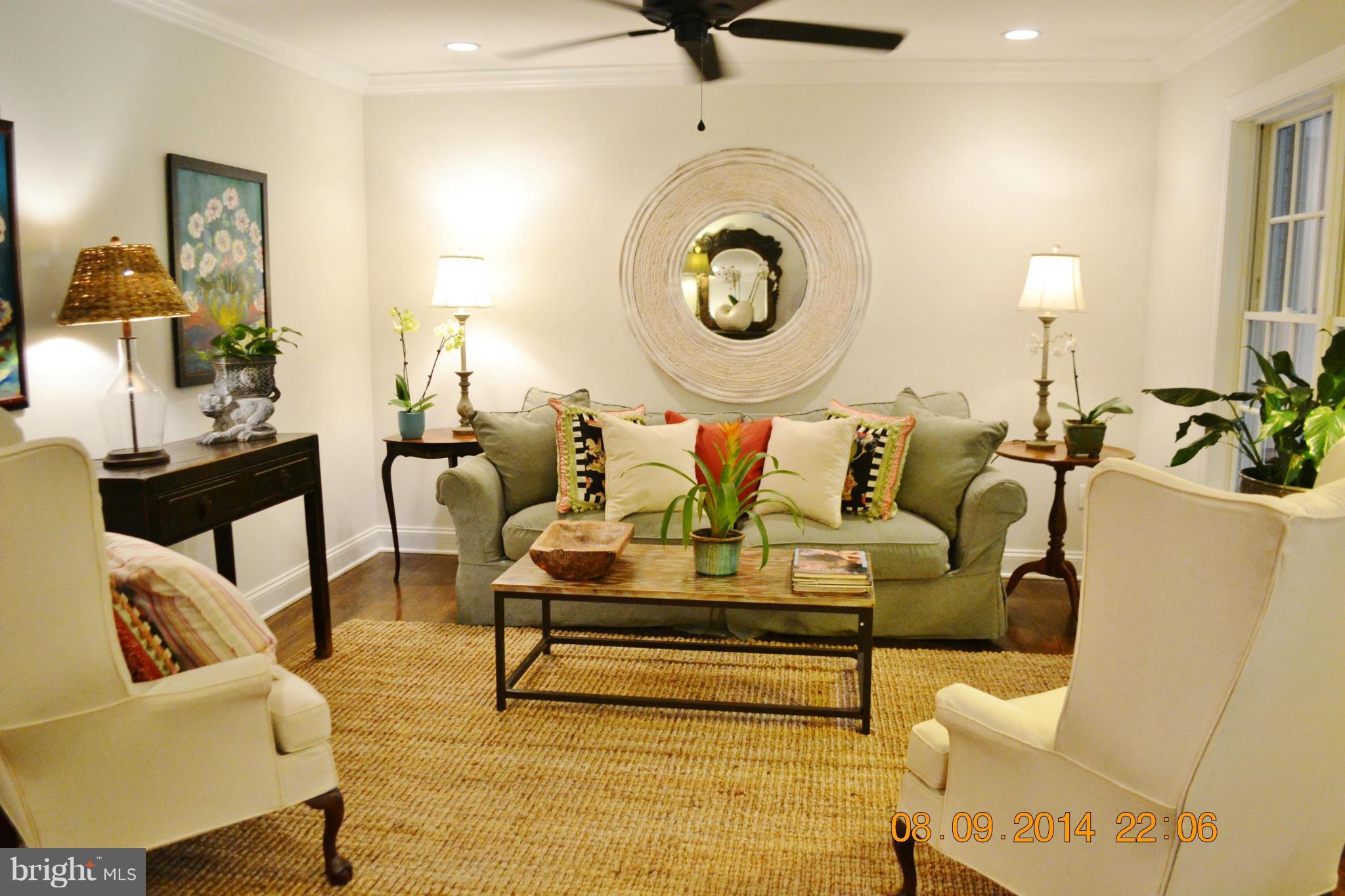 4242 Butler Road Glyndon, MD 21136 - Photo 6 of 29 a living room with furniture and a clock