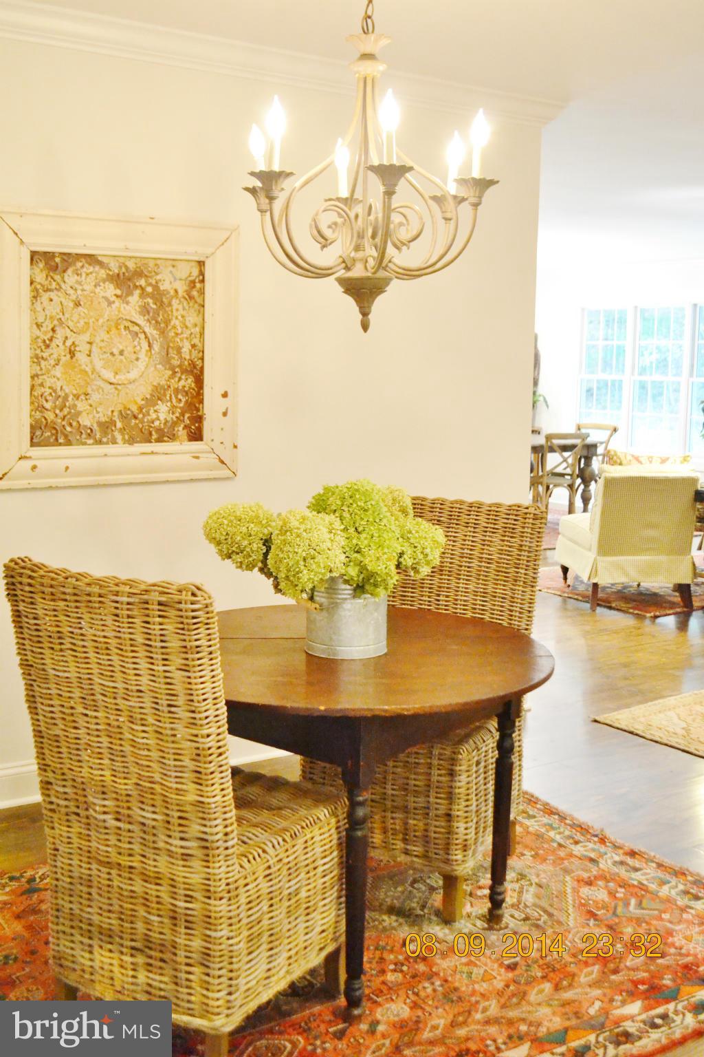 4242 Butler Road Glyndon, MD 21136 - Photo 7 of 29 a view of a dining room with furniture and wooden floor