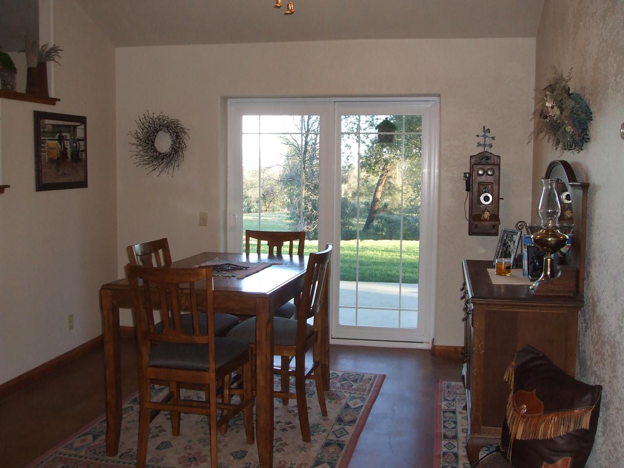 13431 Intermountain Road Redding, CA 96003 - Photo 11 of 49 a view of a dining room with furniture window and outside view