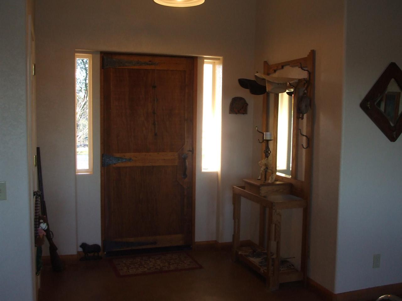 13431 Intermountain Road Redding, CA 96003 - Photo 22 of 49 an entryway with wooden floor and cabinet