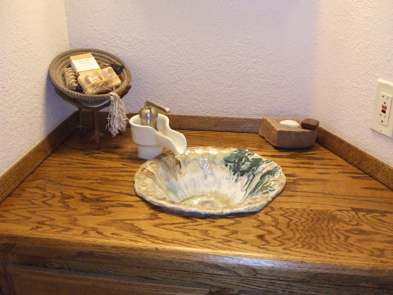13431 Intermountain Road Redding, CA 96003 - Photo 27 of 49 a bathroom with a sink and mirror