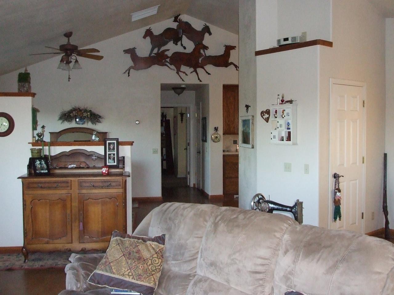 13431 Intermountain Road Redding, CA 96003 - Photo 32 of 49 a bedroom with a bed and cabinets