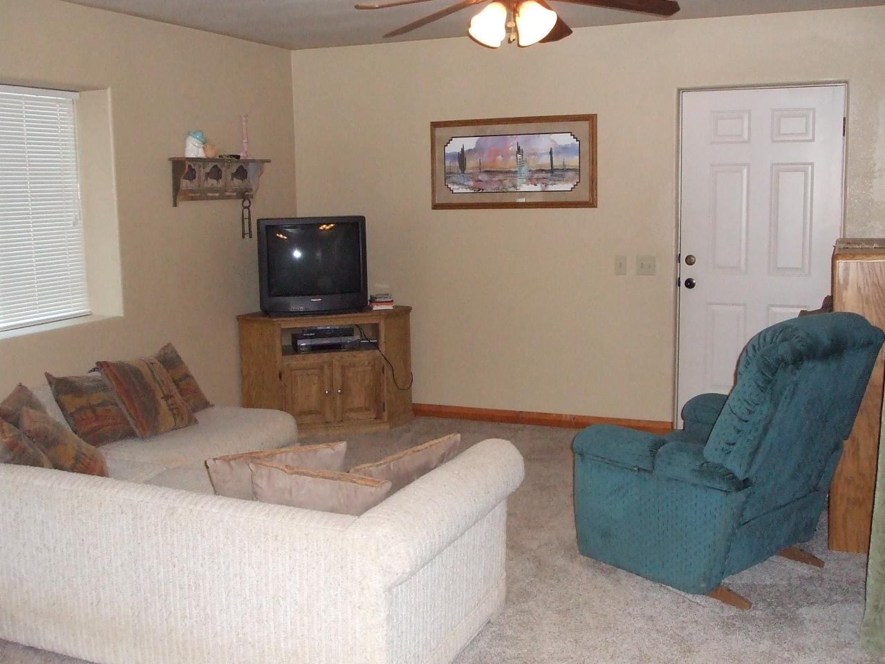 13431 Intermountain Road Redding, CA 96003 - Photo 33 of 49 a living room with furniture and a flat screen tv