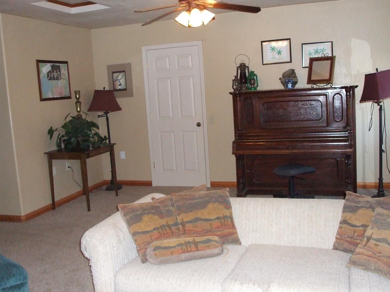 13431 Intermountain Road Redding, CA 96003 - Photo 34 of 49 a living room with furniture and a dresser
