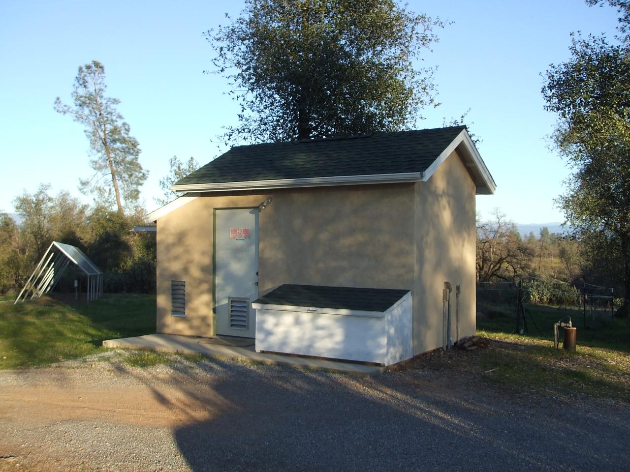 13431 Intermountain Road Redding, CA 96003 - Photo 43 of 49 a front view of a house with a yard and garage