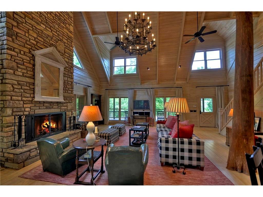 2385 Gates Chapel Road Ellijay, GA 30540 - Photo 1 of 1 Family room. Family room in the main house boasts soaring ceilings in the open concept living space. The soaring ceilings are punctuated by a stacked stone fireplace.