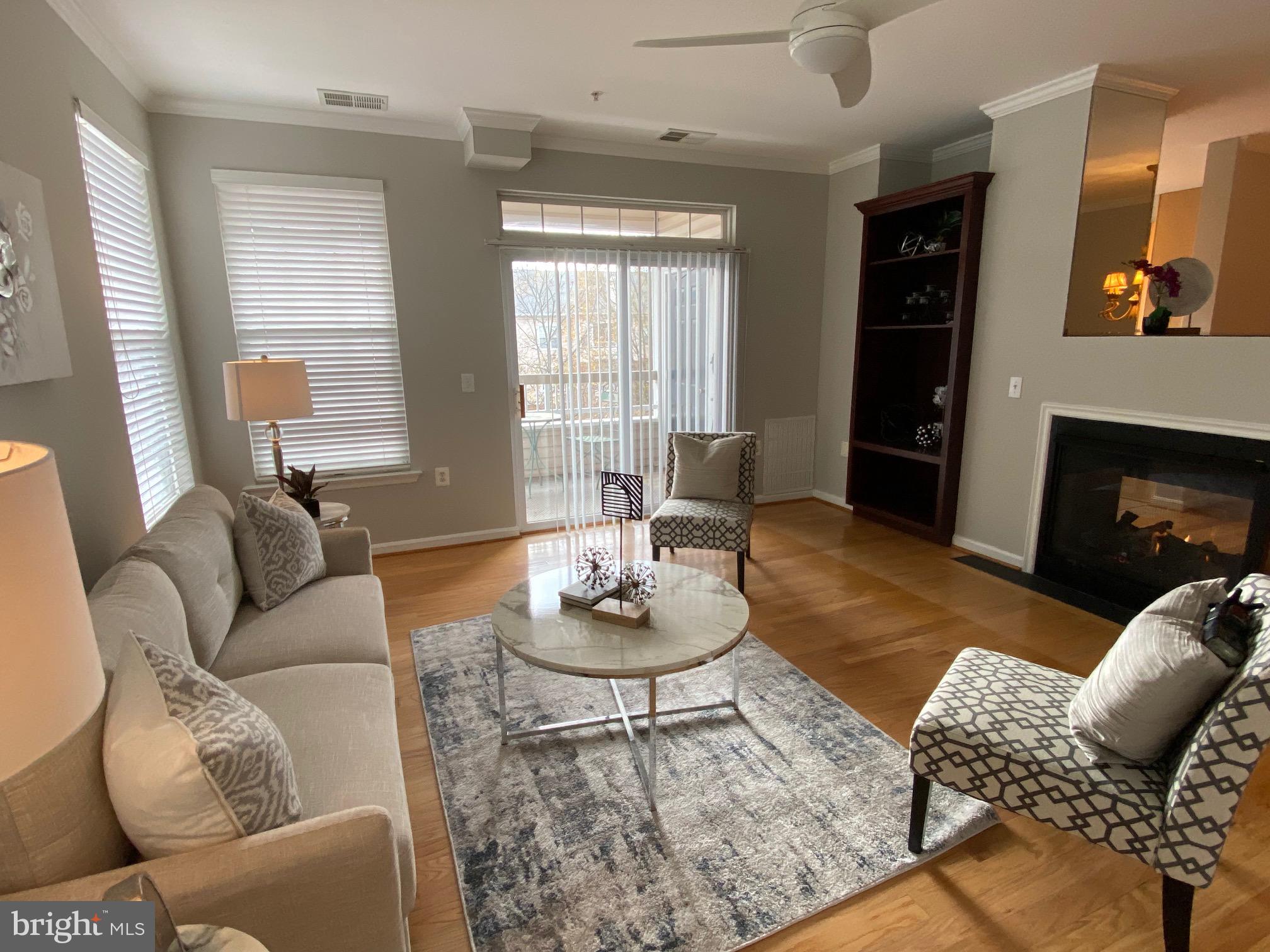 4300 Cannon Ridge Court, Unit 15 Fairfax, VA 22033 - Photo 1 of 24 a living room with furniture and a fireplace