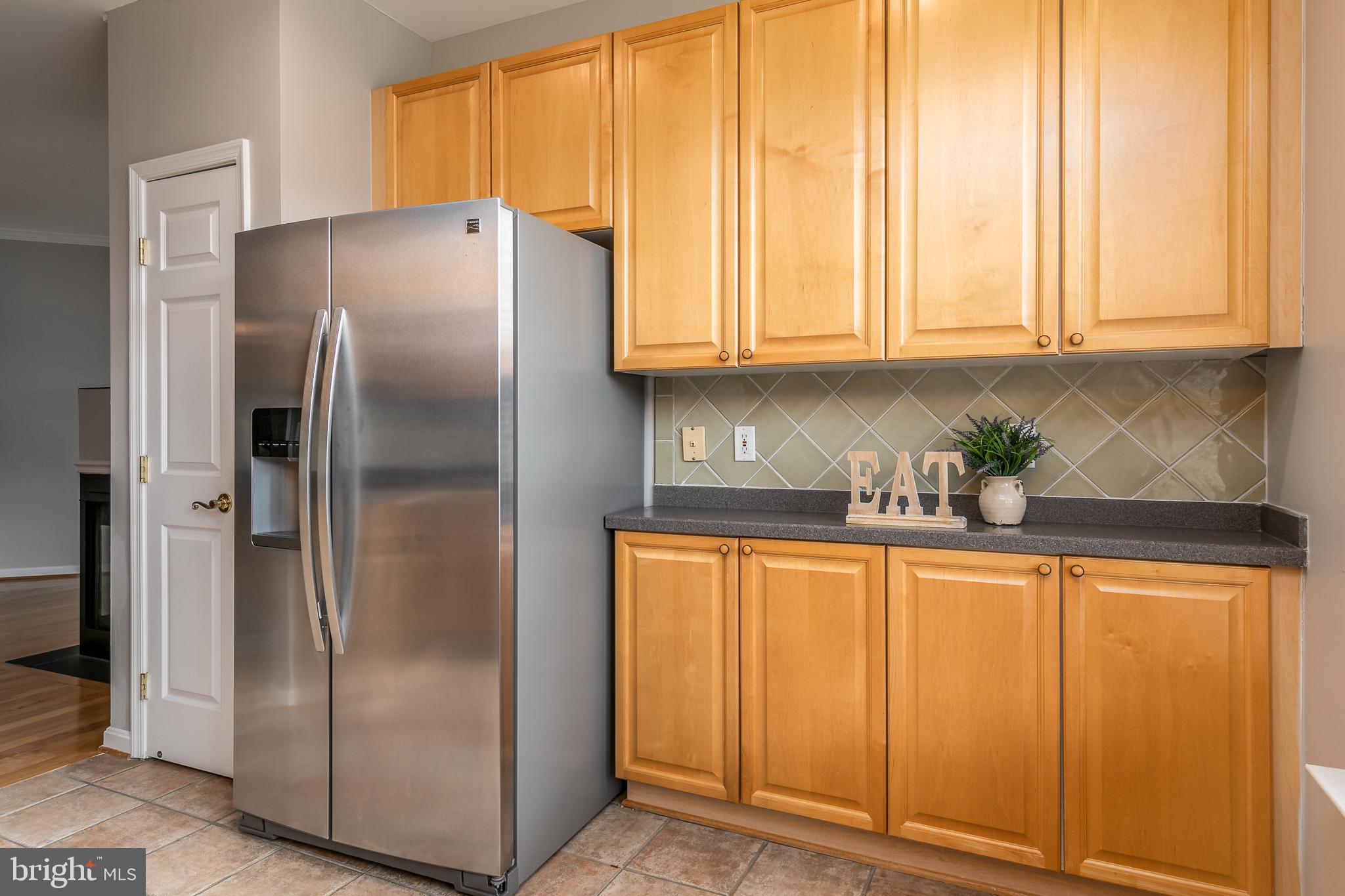 4300 Cannon Ridge Court, Unit 15 Fairfax, VA 22033 - Photo 11 of 24 a kitchen with stainless steel appliances granite countertop a refrigerator and a white cabinets