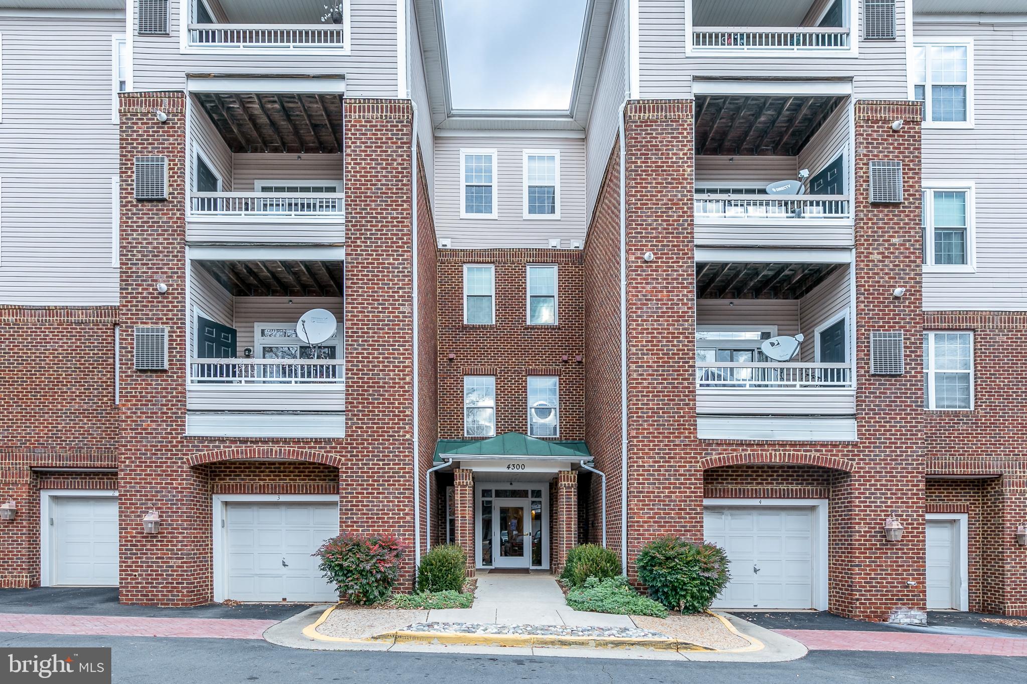 4300 Cannon Ridge Court, Unit 15 Fairfax, VA 22033 - Photo 2 of 24 a front view of a multi story residential apartment building