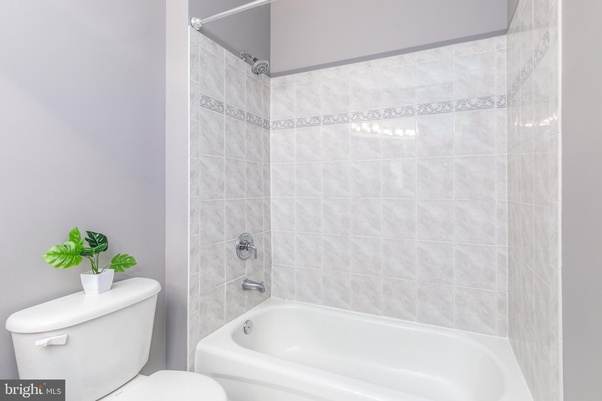 4300 Cannon Ridge Court, Unit 15 Fairfax, VA 22033 - Photo 21 of 24 a white bath tub sitting next to a toilet