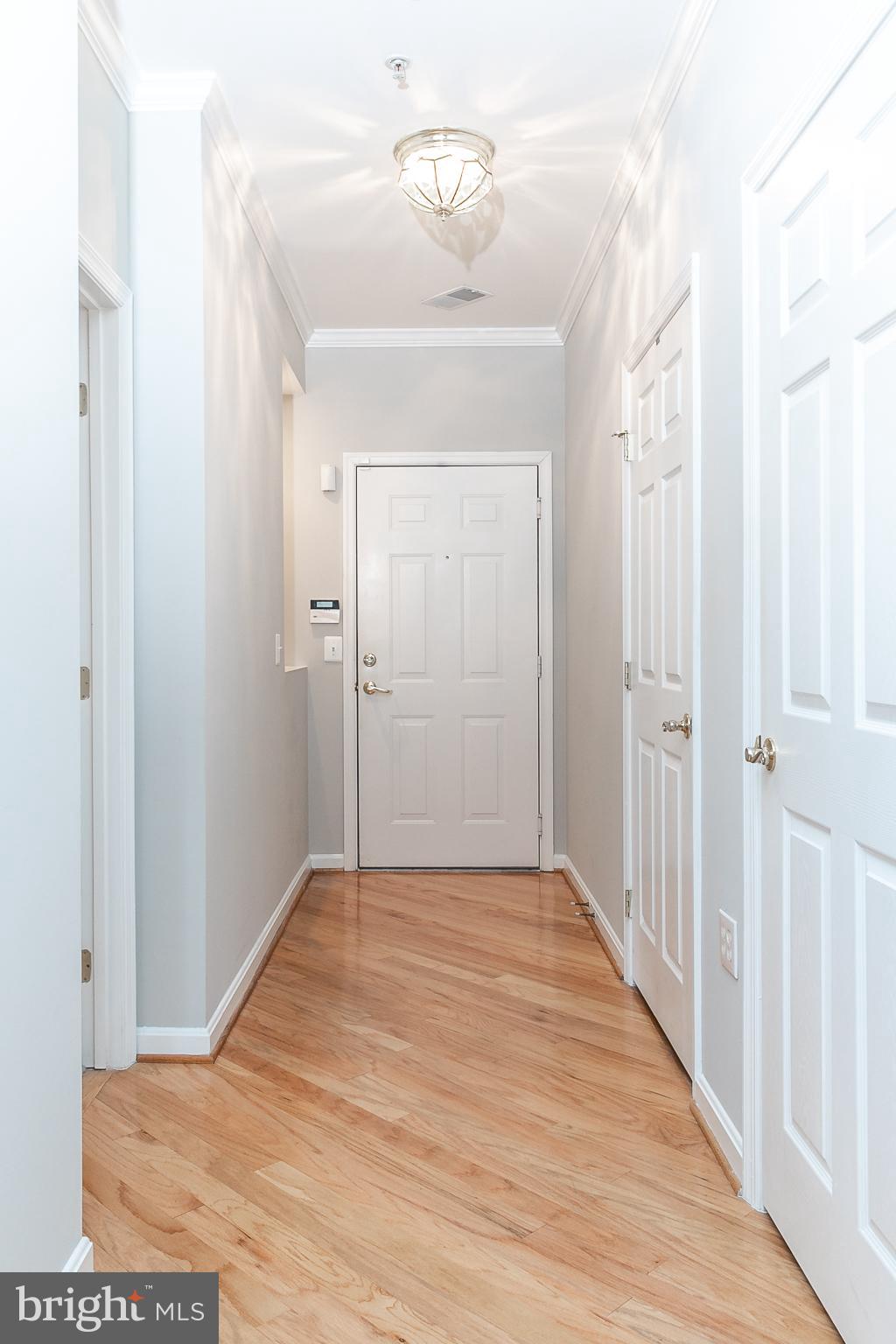 4300 Cannon Ridge Court, Unit 15 Fairfax, VA 22033 - Photo 3 of 24 a view of a hallway with wooden floor
