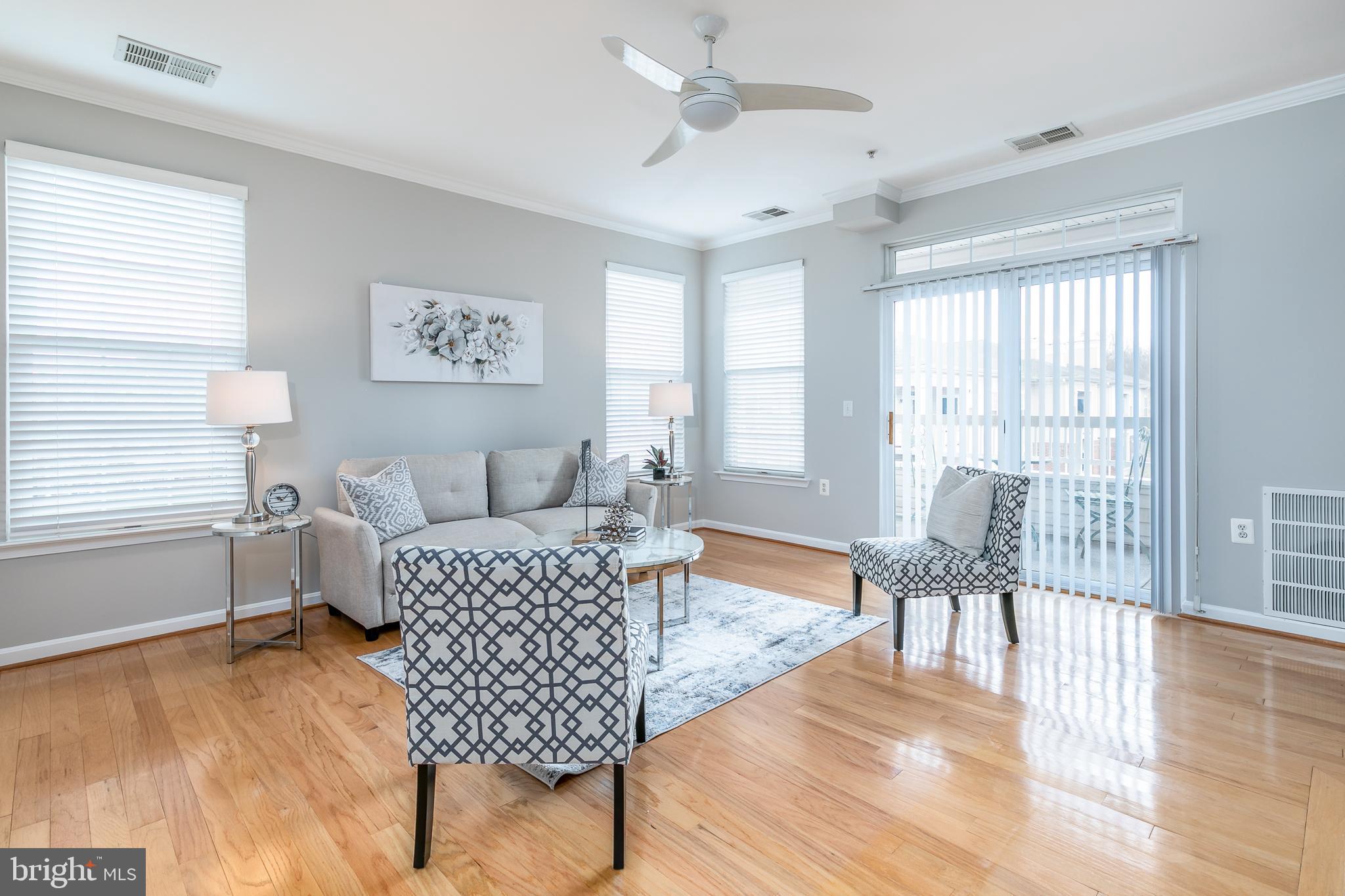 4300 Cannon Ridge Court, Unit 15 Fairfax, VA 22033 - Photo 5 of 24 a living room with furniture and a table with wooden floor