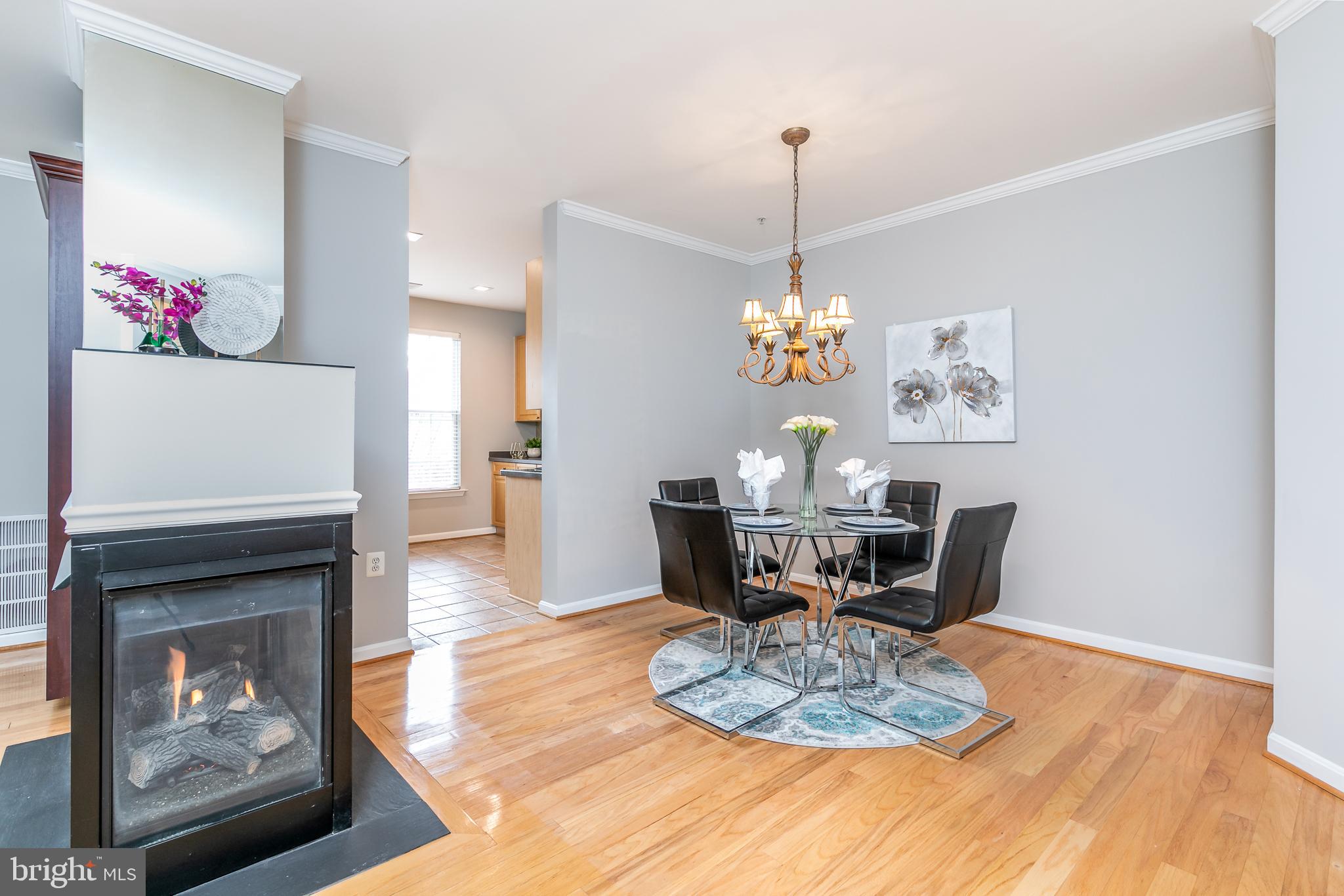 4300 Cannon Ridge Court, Unit 15 Fairfax, VA 22033 - Photo 8 of 24 a view of a dining room with furniture a chandelier and wooden floor