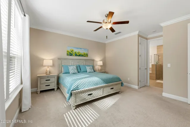 a view of walk in closet with clothes