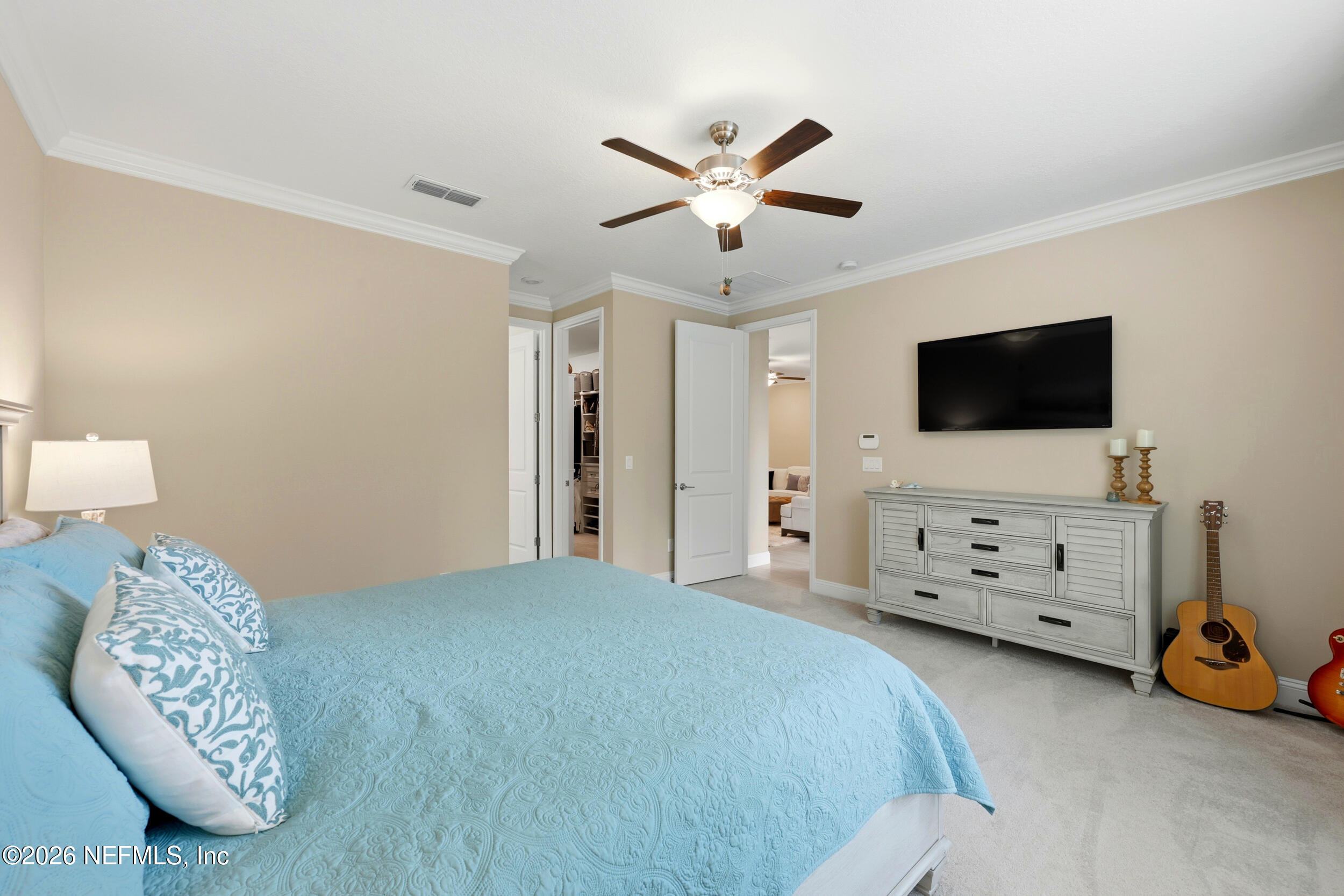 25 Waterbrook Place St. Augustine, FL 32095 - Photo 15 of 55 a bedroom with a bed and a flat screen tv