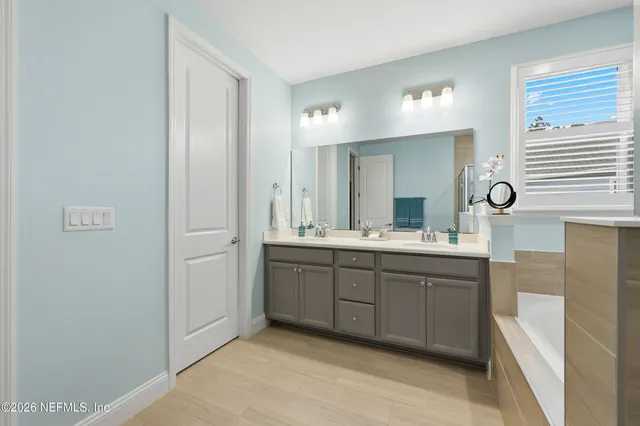 a bathroom with a shower and a sink