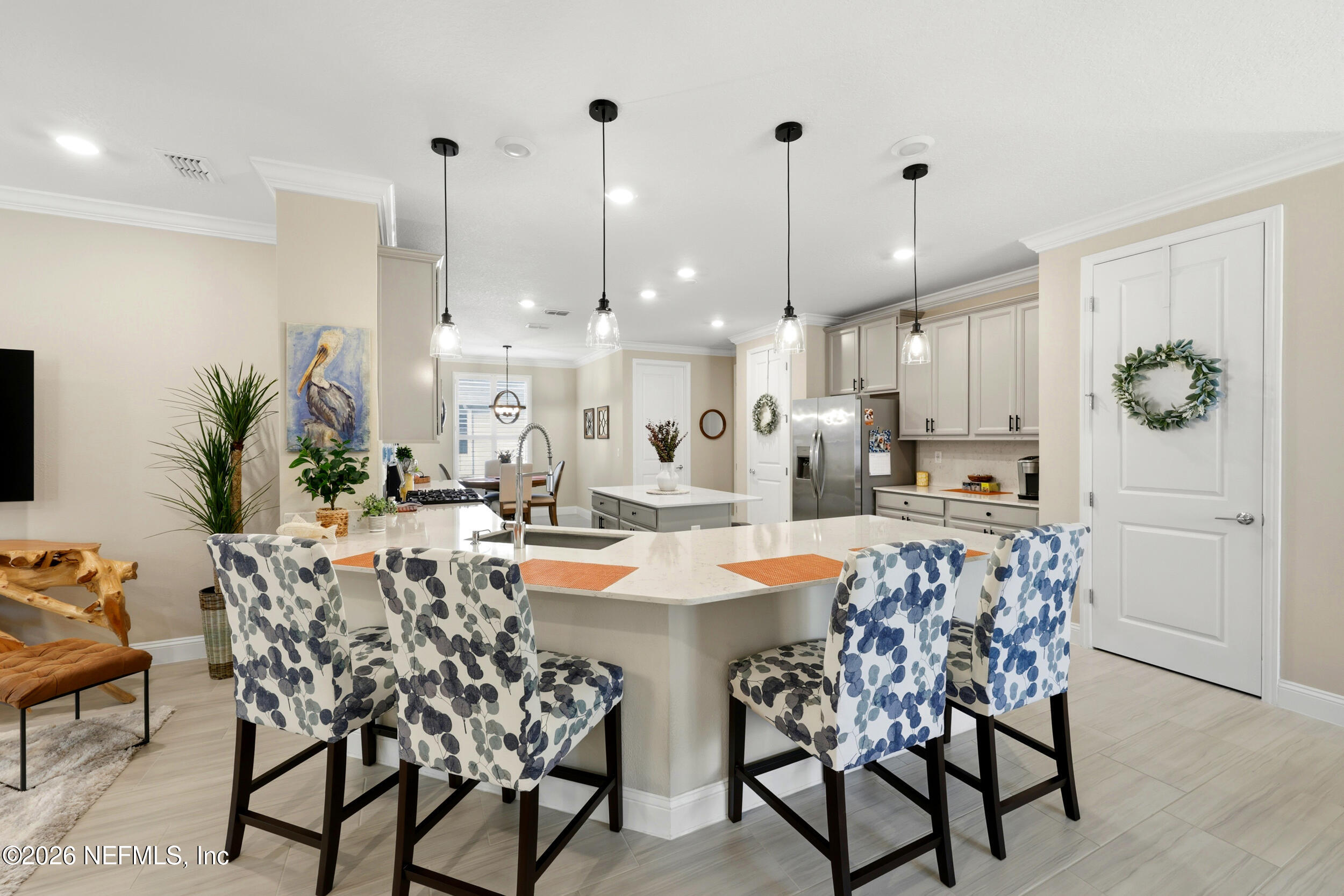 25 Waterbrook Place St. Augustine, FL 32095 - Photo 22 of 55 a view of a dining room and livingroom with furniture wooden floor a chandelier