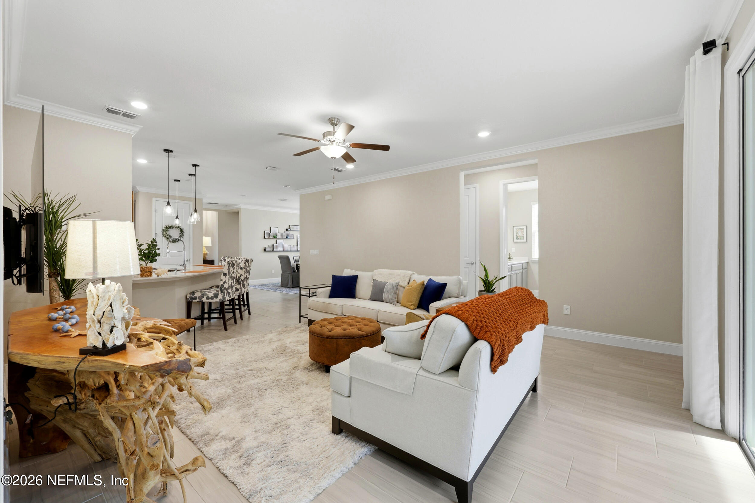 25 Waterbrook Place St. Augustine, FL 32095 - Photo 27 of 55 a living room with furniture kitchen view and a chandelier