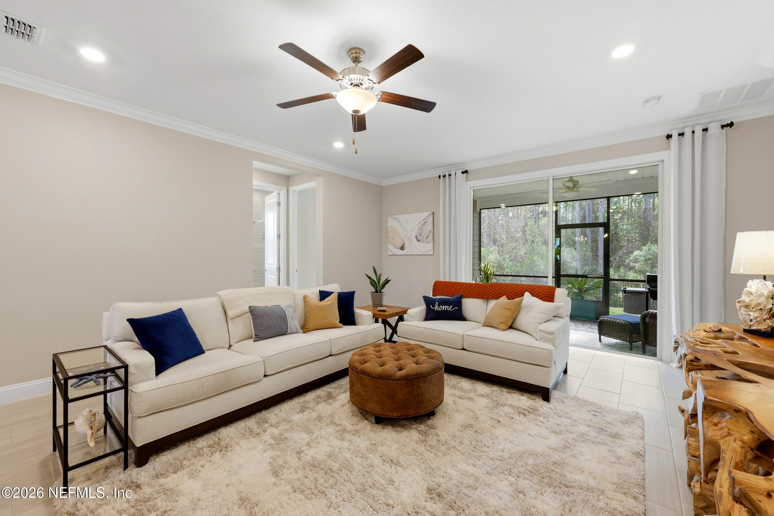 25 Waterbrook Place St. Augustine, FL 32095 - Photo 28 of 55 a living room with furniture ceiling fan and a large window