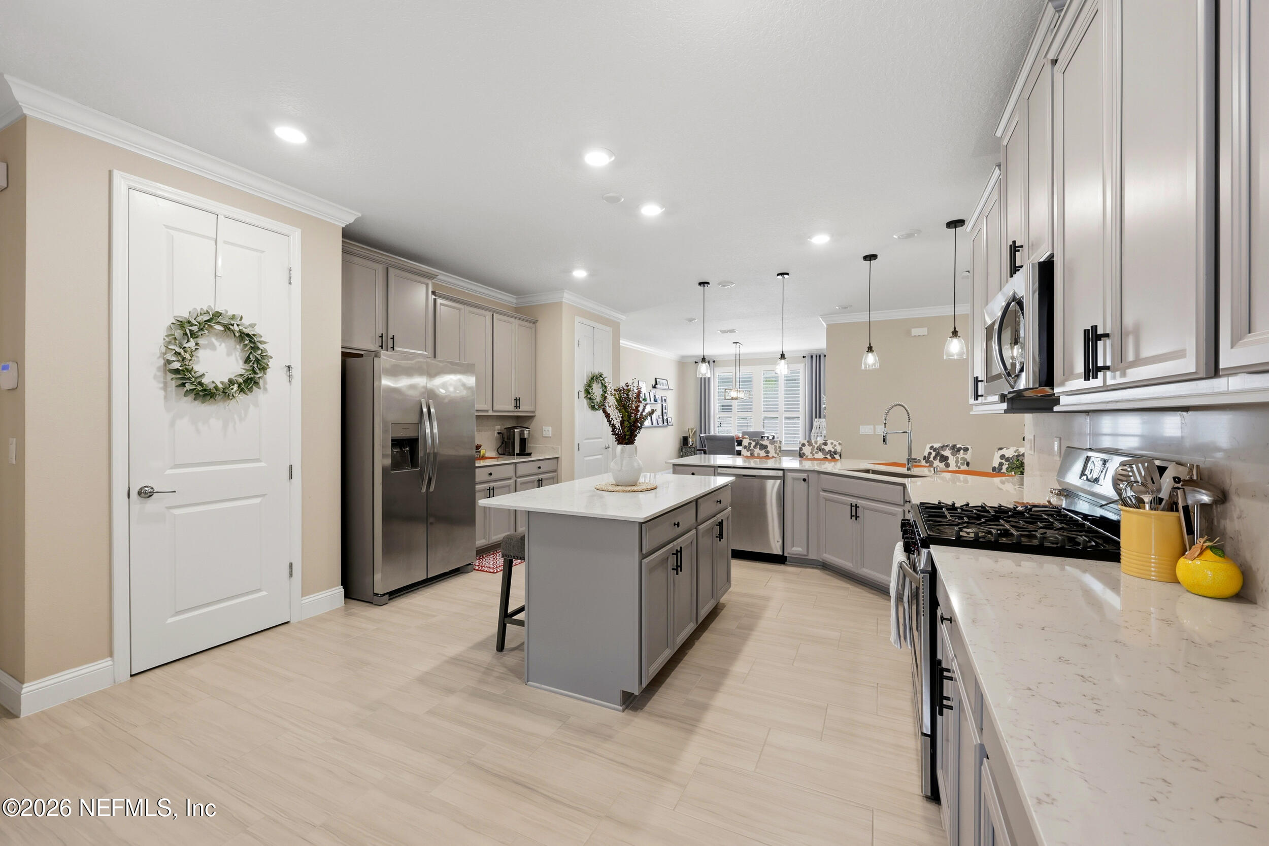 25 Waterbrook Place St. Augustine, FL 32095 - Photo 32 of 55 a kitchen with a sink stainless steel appliances and cabinets
