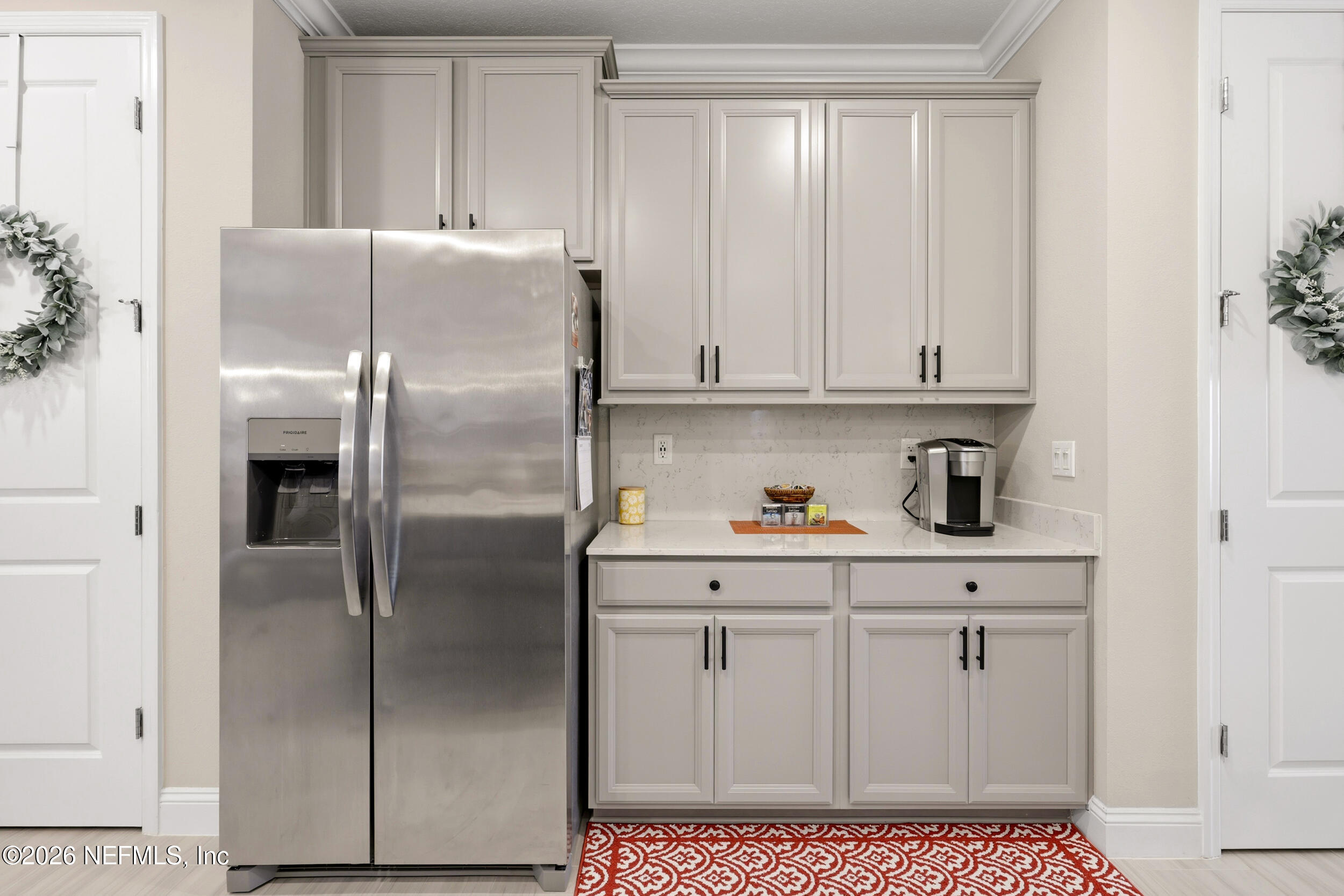 25 Waterbrook Place St. Augustine, FL 32095 - Photo 35 of 55 a kitchen with appliances cabinets and a counter top space