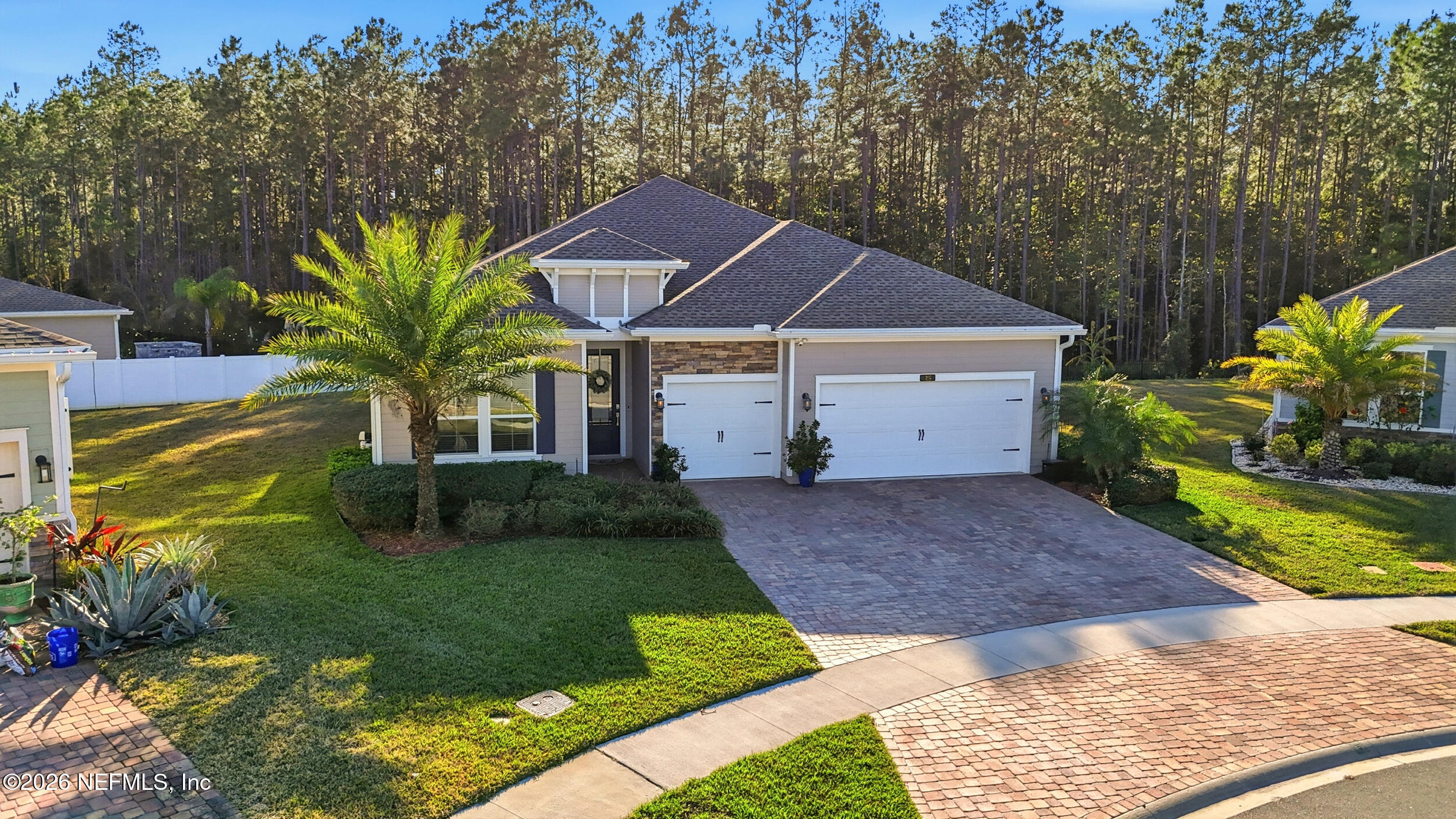 25 Waterbrook Place St. Augustine, FL 32095 - Photo 39 of 55 a view of a house with a small yard plants and large tree