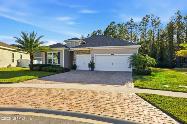 a porch with a bench and a floor to ceiling window