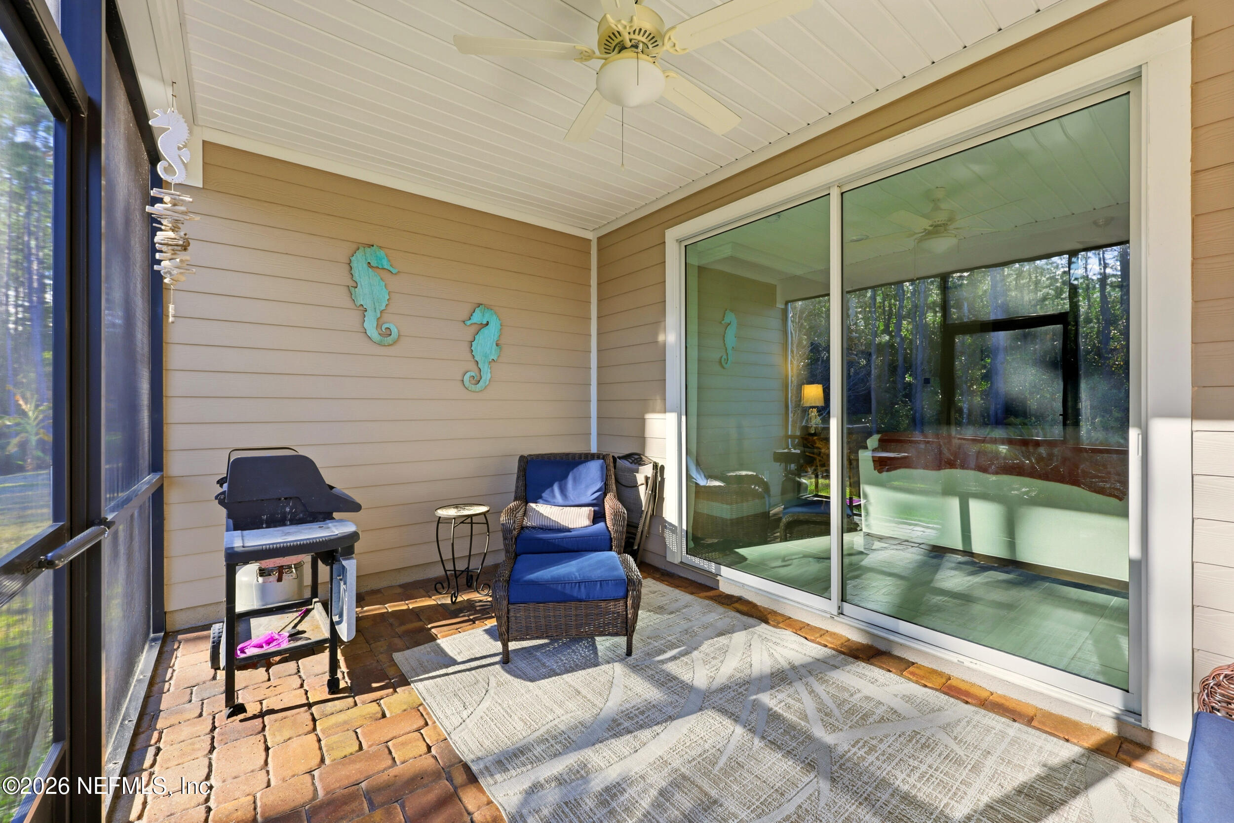 25 Waterbrook Place St. Augustine, FL 32095 - Photo 54 of 55 a balcony with chairs and with glass door