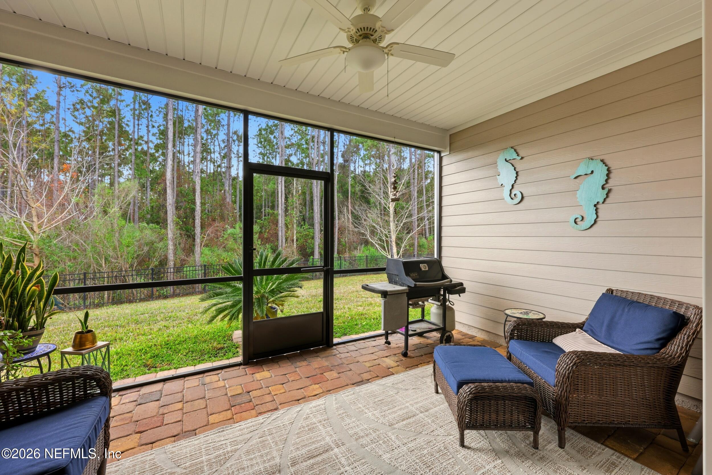 25 Waterbrook Place St. Augustine, FL 32095 - Photo 55 of 55 a porch with a bench and a floor to ceiling window