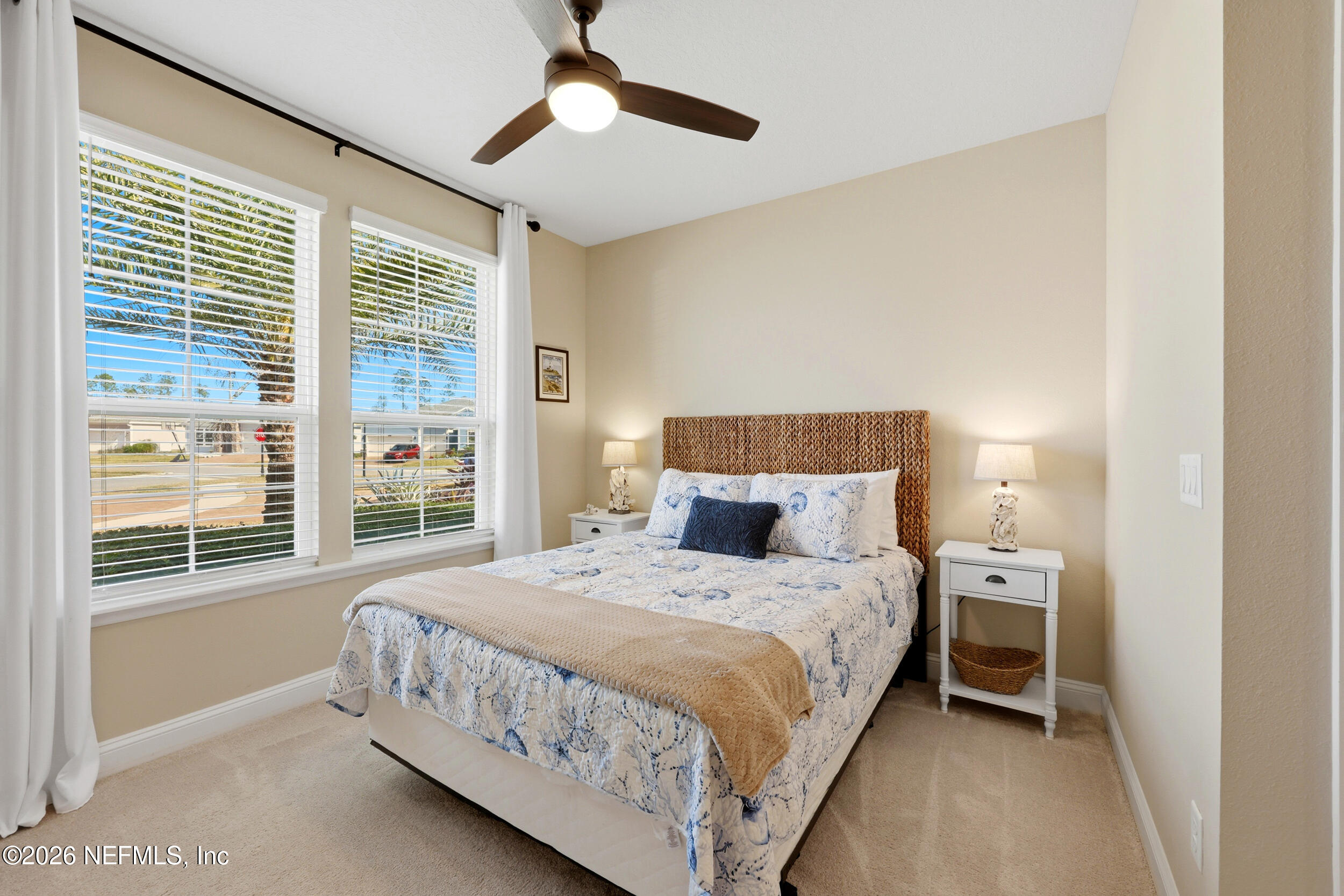 25 Waterbrook Place St. Augustine, FL 32095 - Photo 7 of 55 a bedroom with a bed chandelier and a window