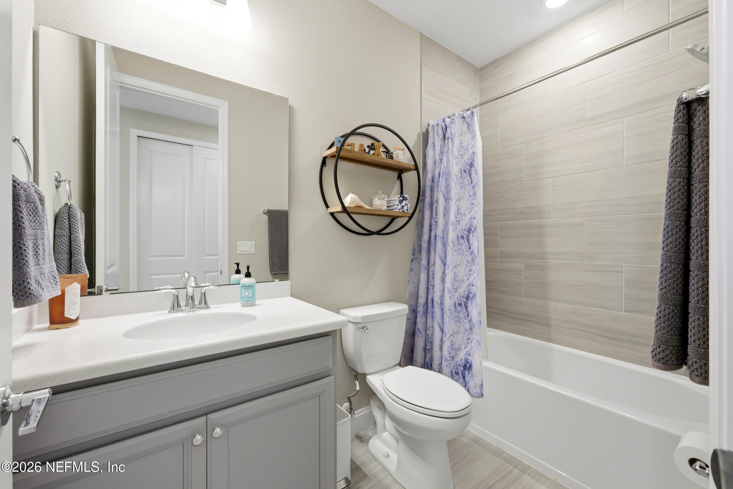 25 Waterbrook Place St. Augustine, FL 32095 - Photo 9 of 55 a bathroom with a sink a toilet and a mirror