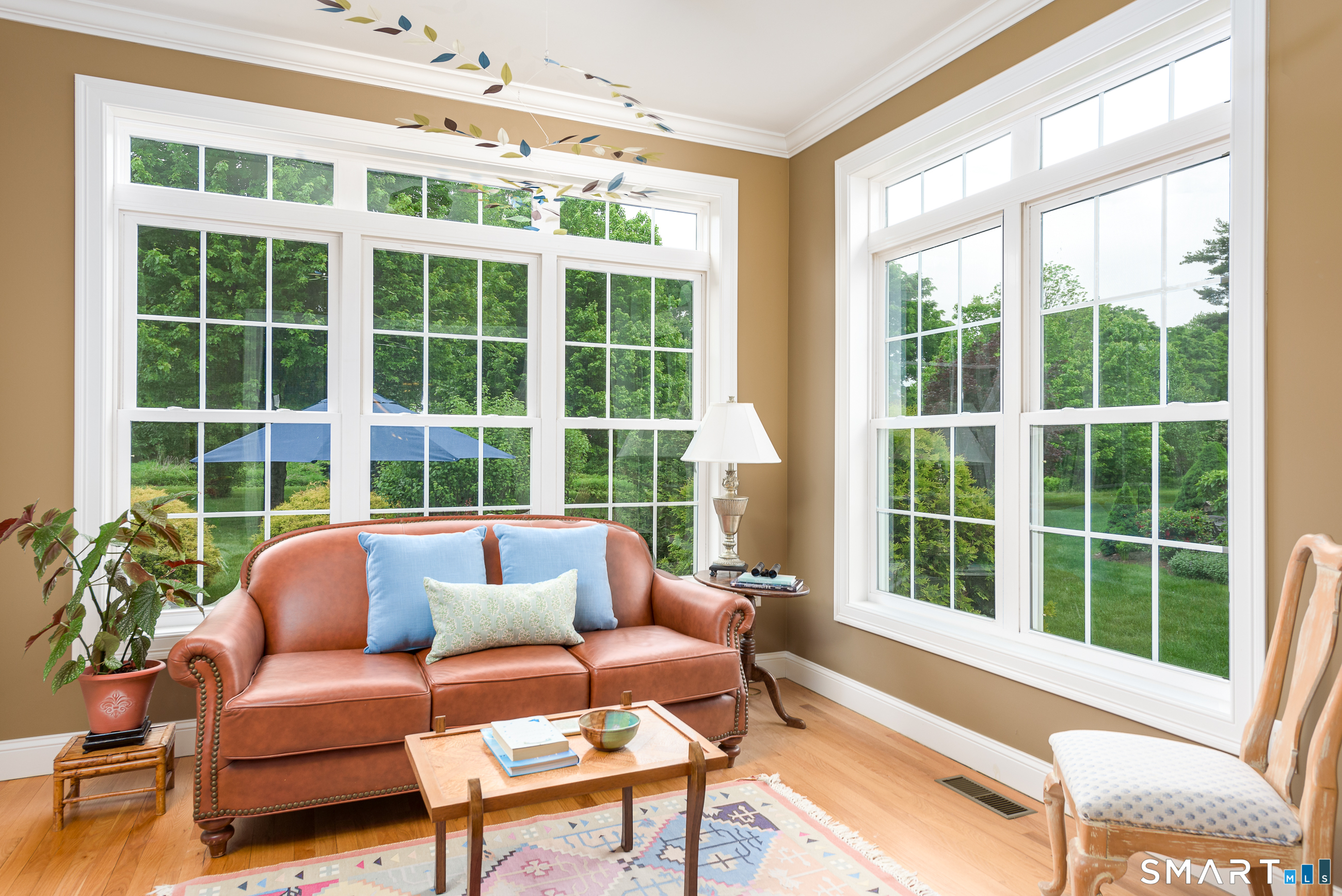8 Greendale Drive, Unit 8 Suffield, CT 06078 - Photo 11 of 40 a living room with furniture and a large window