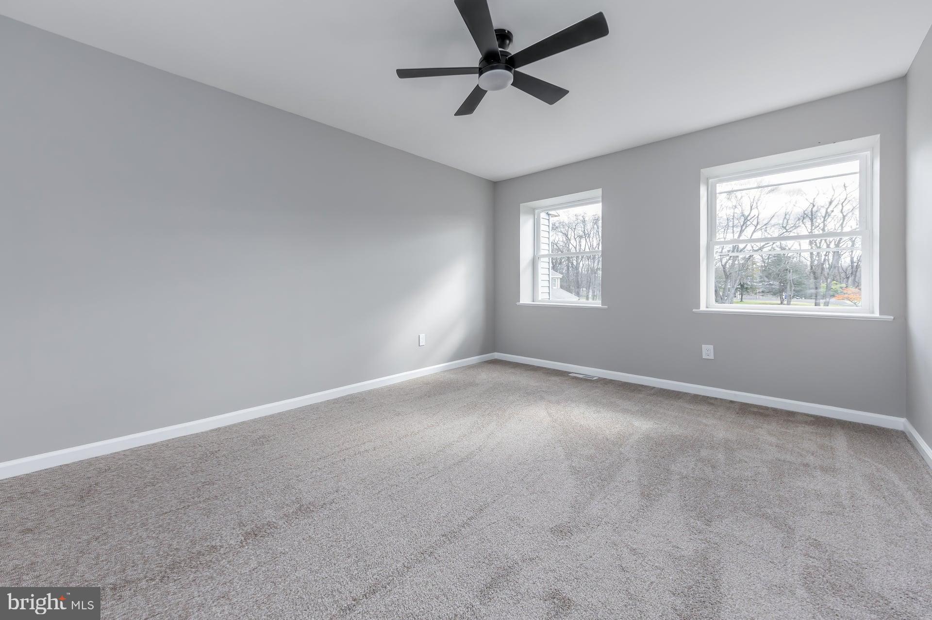 210 Stratton Court Mount Laurel, NJ 08054 - Photo 14 of 20 an empty room with windows and fan