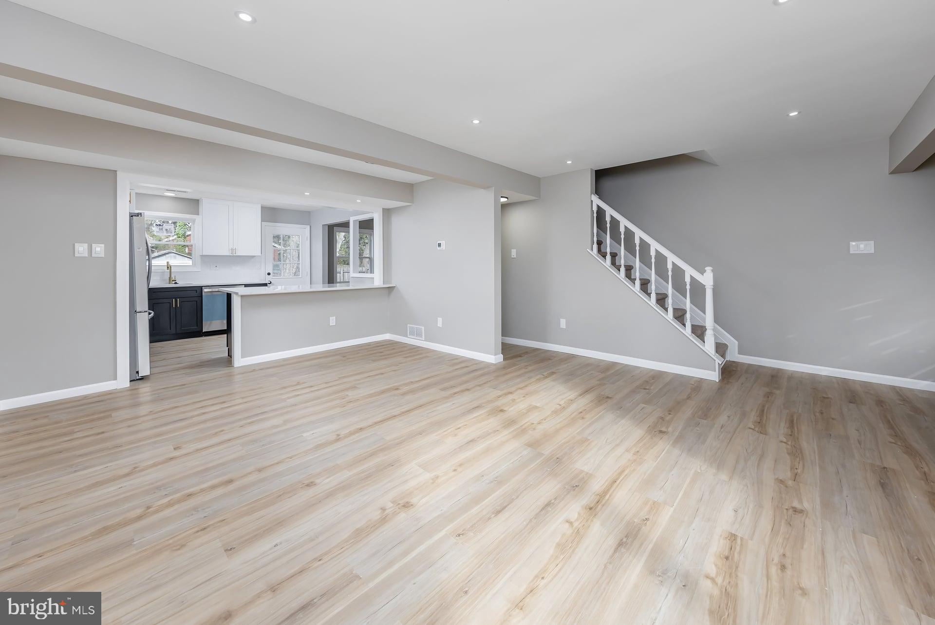 210 Stratton Court Mount Laurel, NJ 08054 - Photo 2 of 20 a view of an empty room with a window and wooden floor