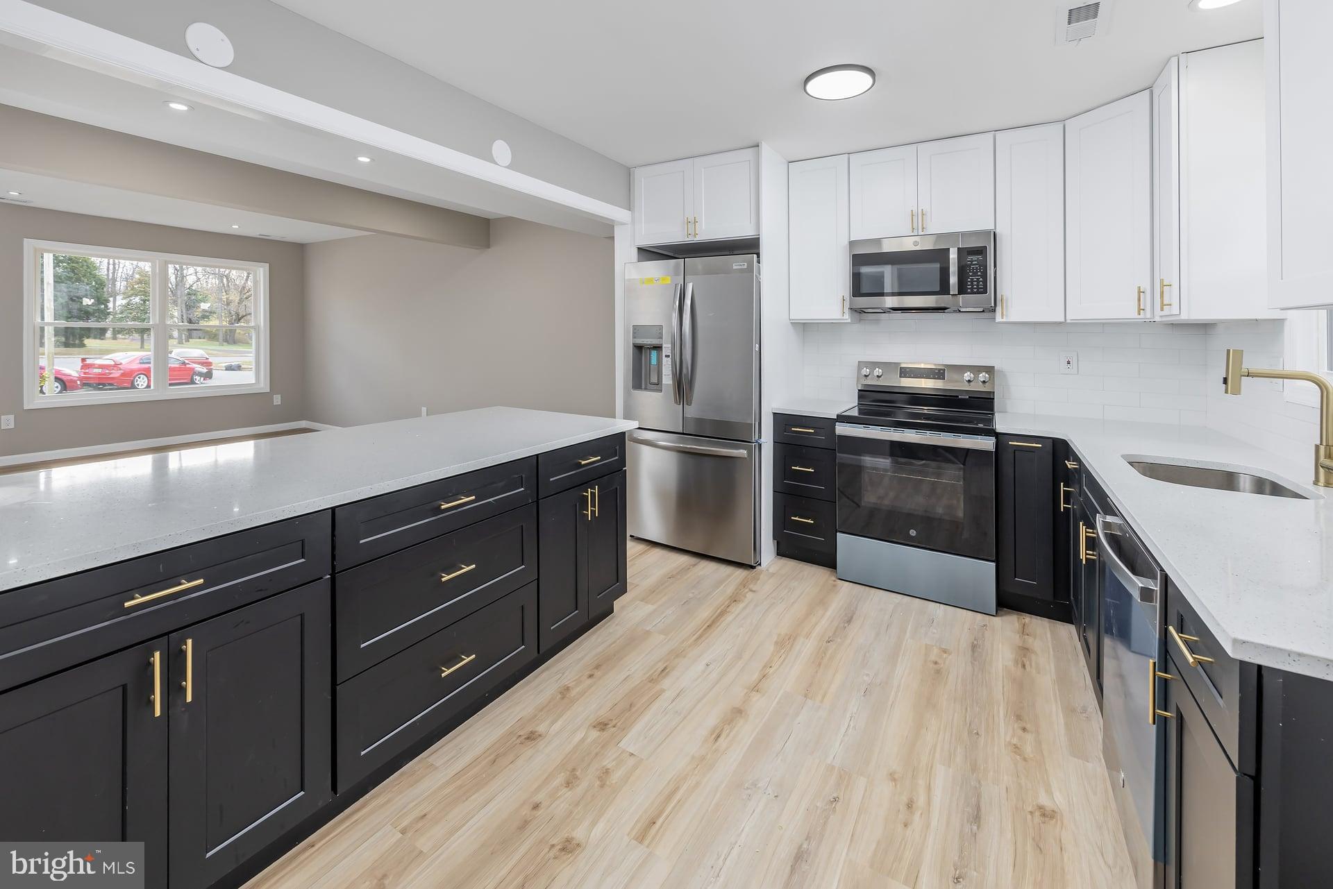210 Stratton Court Mount Laurel, NJ 08054 - Photo 4 of 20 a kitchen with stainless steel appliances granite countertop a refrigerator a stove top oven a sink and dishwasher