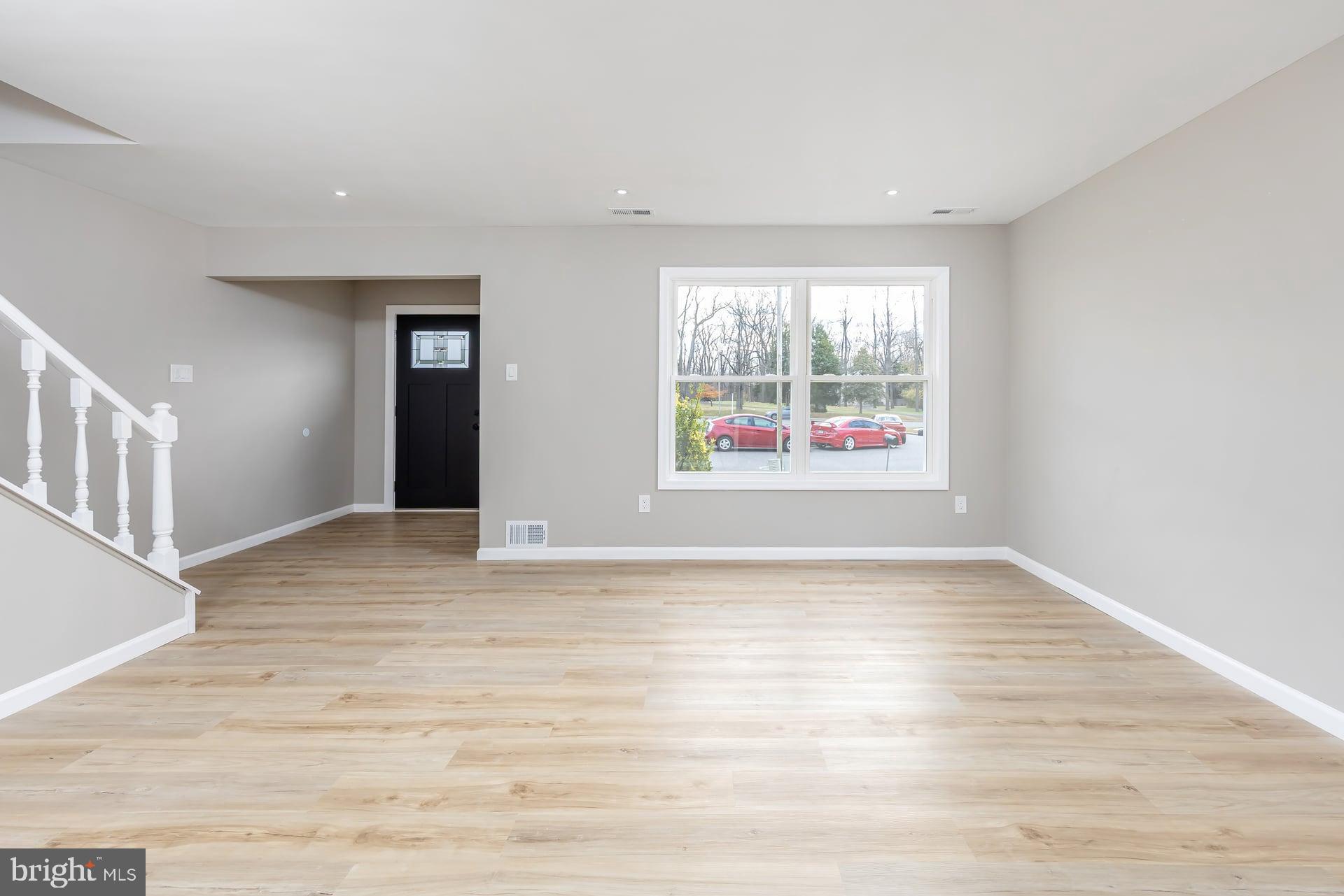 210 Stratton Court Mount Laurel, NJ 08054 - Photo 8 of 20 a view of an empty room with wooden floor and a window