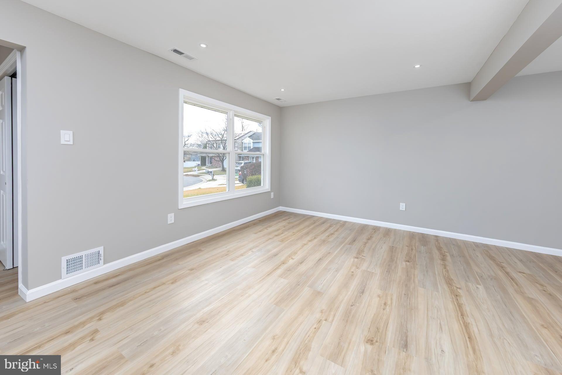 210 Stratton Court Mount Laurel, NJ 08054 - Photo 9 of 20 wooden floor in an empty room with a window