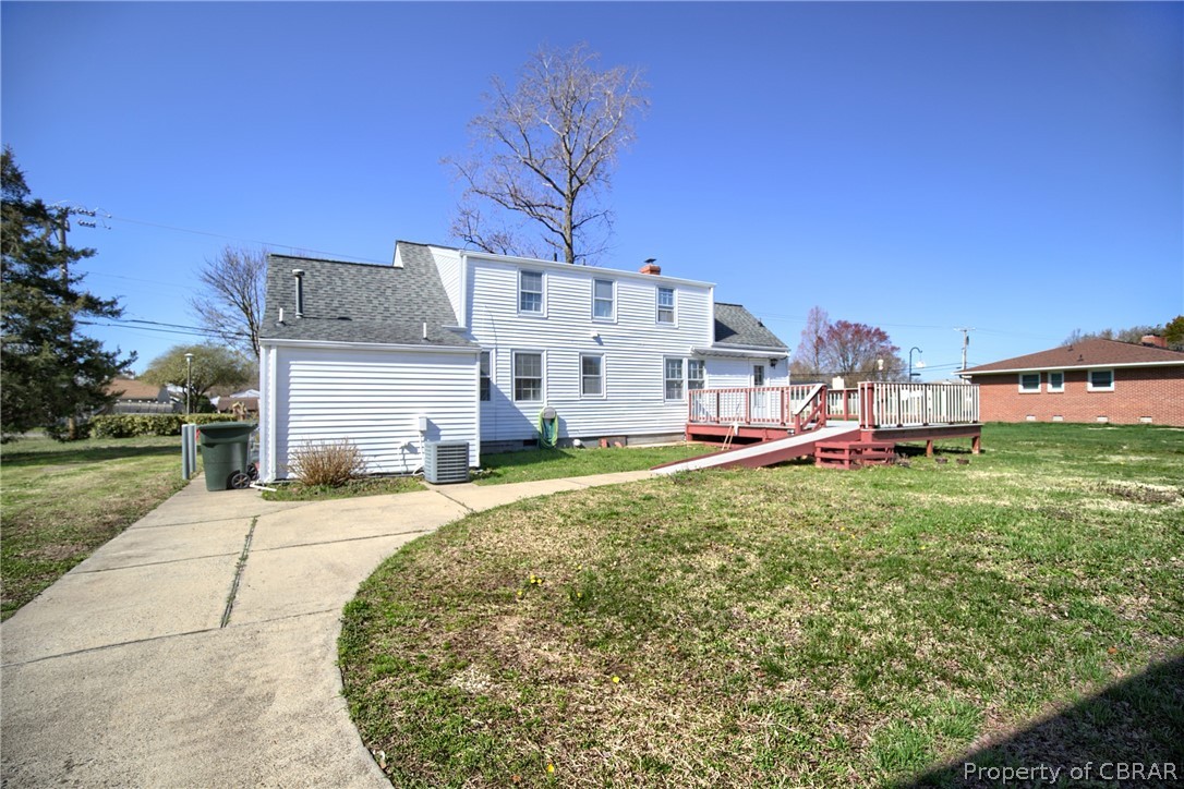 12 Old Meribeth Road Hampton, VA 23669 - Photo 5 of 32 Back of property with a wooden deck, central AC, and a yard