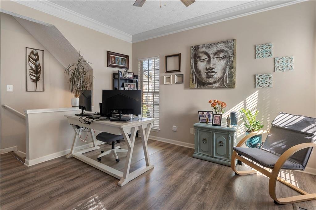 4074 Spring Cove Drive Duluth, GA 30097 - Photo 11 of 48 a view of a workspace with furniture and wooden floor