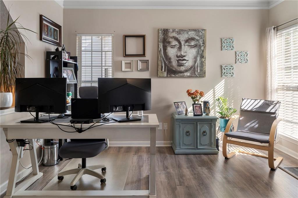 4074 Spring Cove Drive Duluth, GA 30097 - Photo 13 of 48 a workspace with furniture and wooden floor