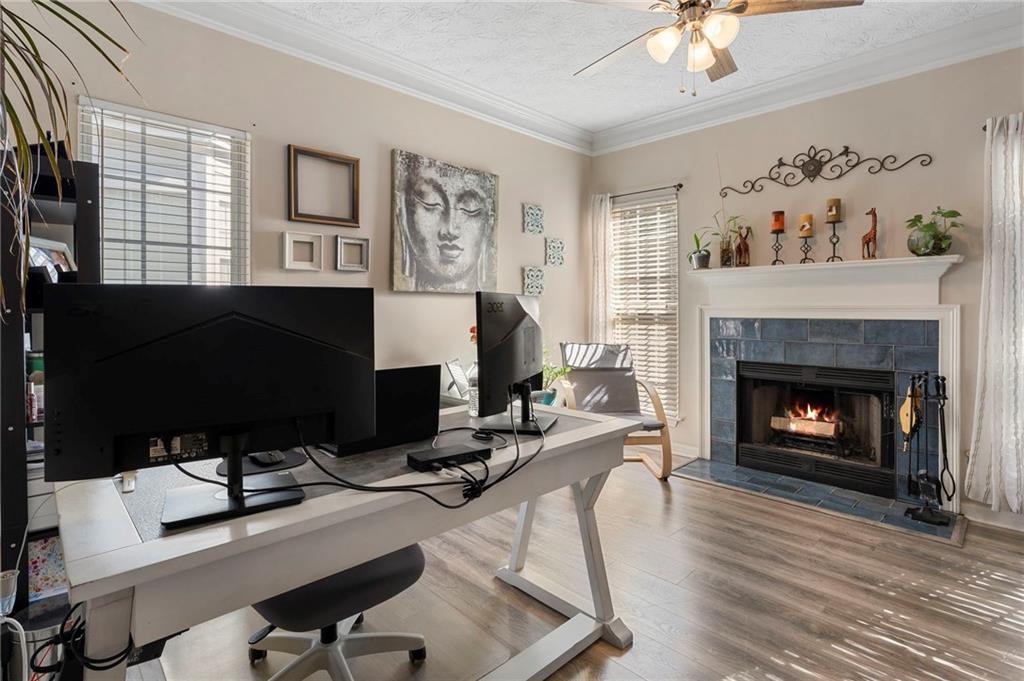 4074 Spring Cove Drive Duluth, GA 30097 - Photo 14 of 48 a work room with furniture and a fireplace