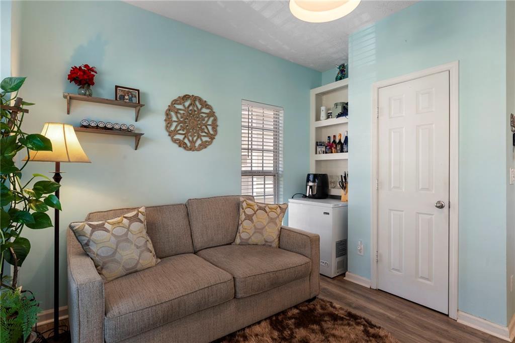 4074 Spring Cove Drive Duluth, GA 30097 - Photo 17 of 48 a living room with furniture and a window
