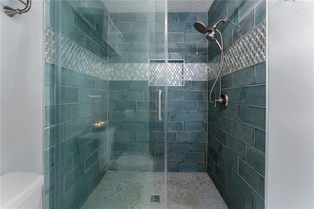 4074 Spring Cove Drive Duluth, GA 30097 - Photo 32 of 48 a bathroom with a shower